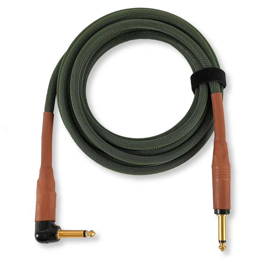 A coiled audio cable with a textured olive green braided jacket, brown leather-like plugs, and gold-plated connectors, shown on a plain white background.