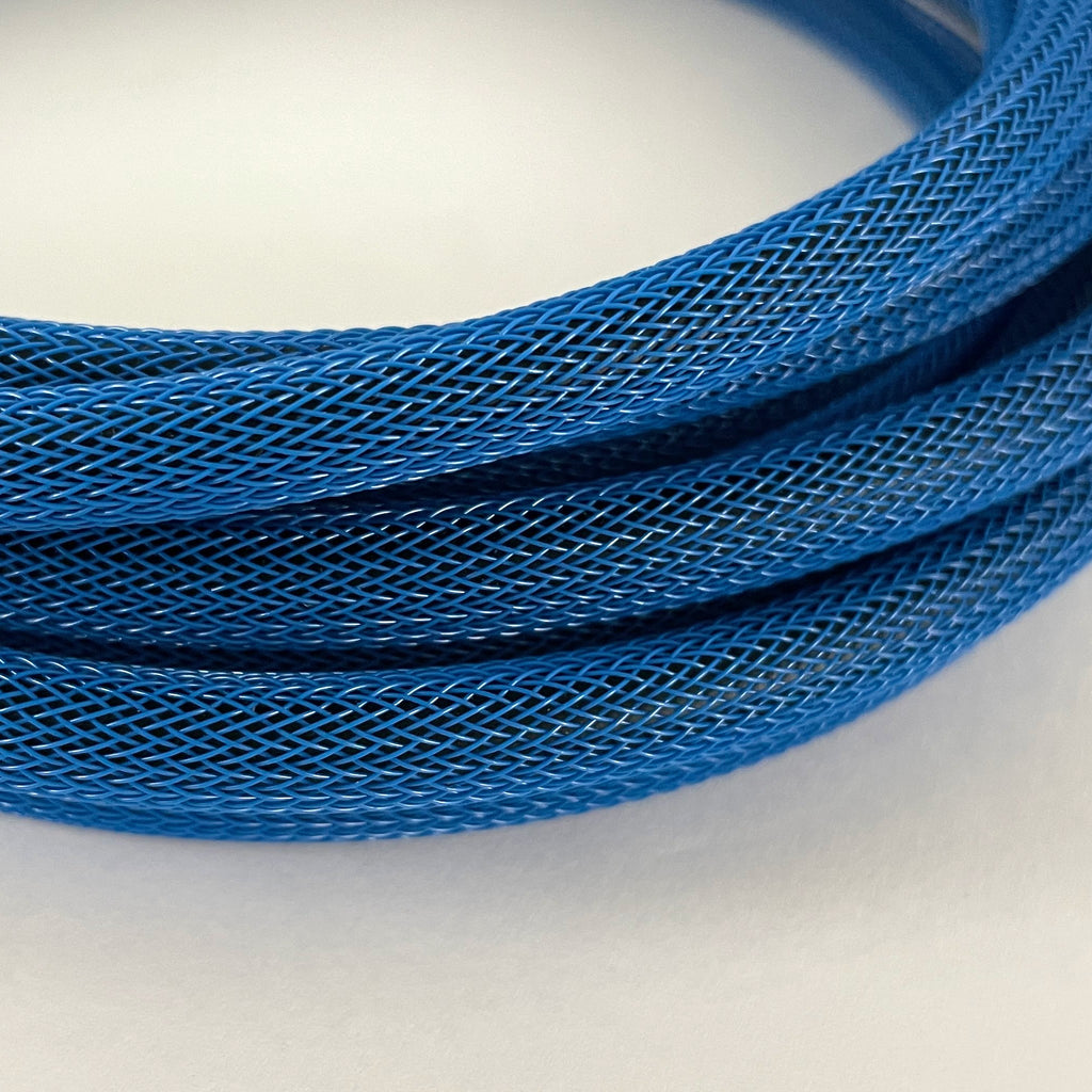 A close-up of a coiled blue braided cable or wire showing the detailed woven texture against a plain light background.