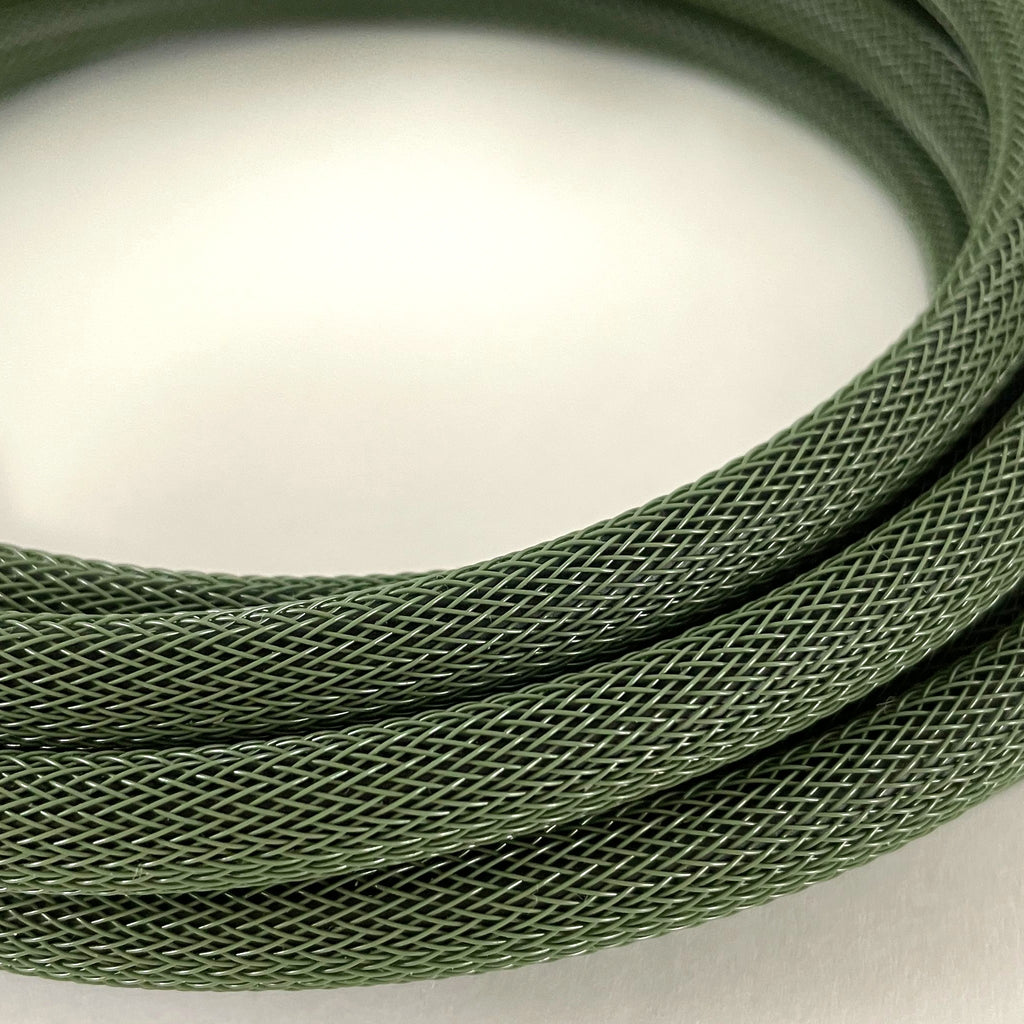 A close-up of a coiled olive green braided cable or cord on a plain light background.